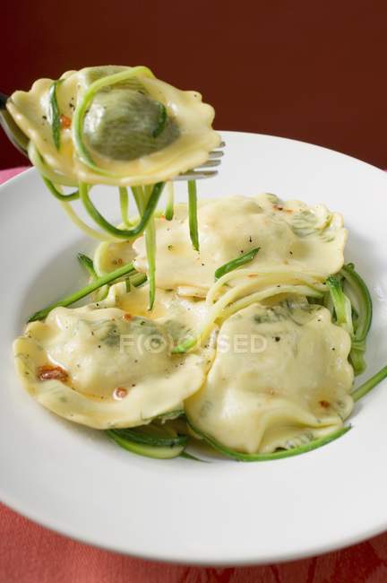 Ravioli pasta with courgette laces — Stock Photo