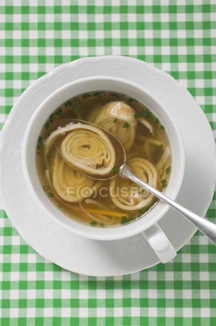 Pancake soup with vegetables and chives — Stock Photo