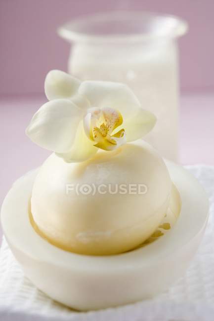 Perfumed soap in soap dish with towel and windlight — Stock Photo