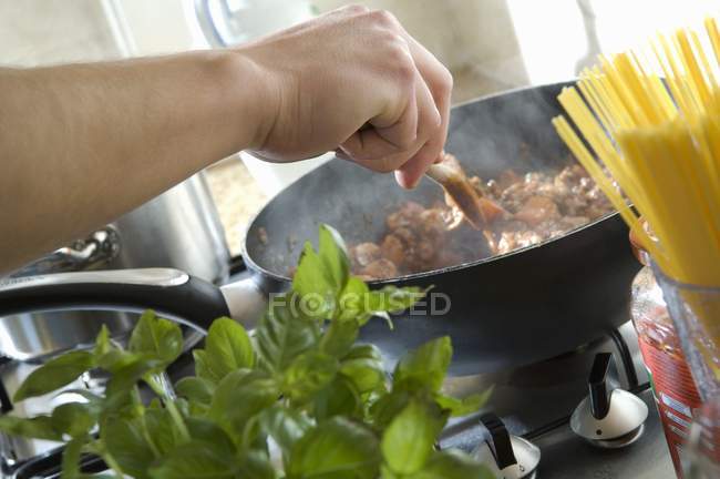 Chef cooking meat — Stock Photo