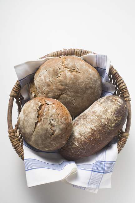 Three,rustic,loaves,bread,br — Stock Photo