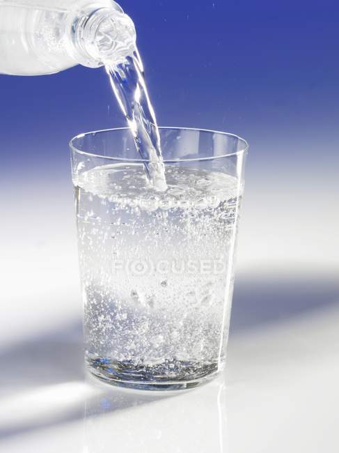 Pouring mineral water — Stock Photo
