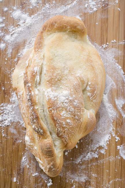 Rustic bread with flour — Stock Photo