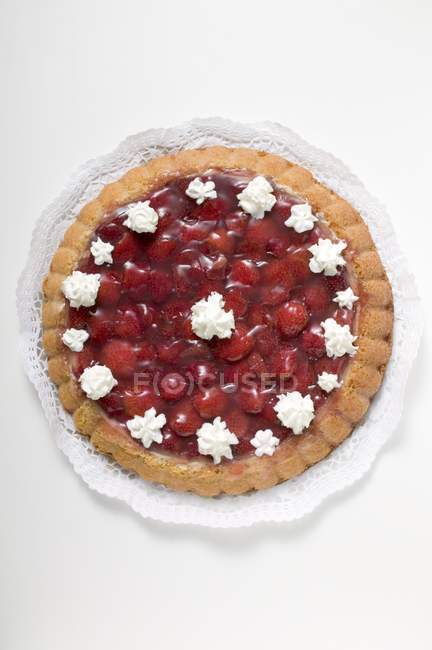 Top view of cherry Flan with cream rosettes — Stock Photo