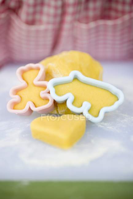 Closeup view of cutting out biscuits from dough — Stock Photo