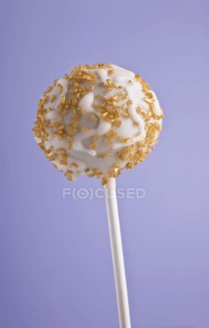 Cake pop with golden sprinkles — Stock Photo