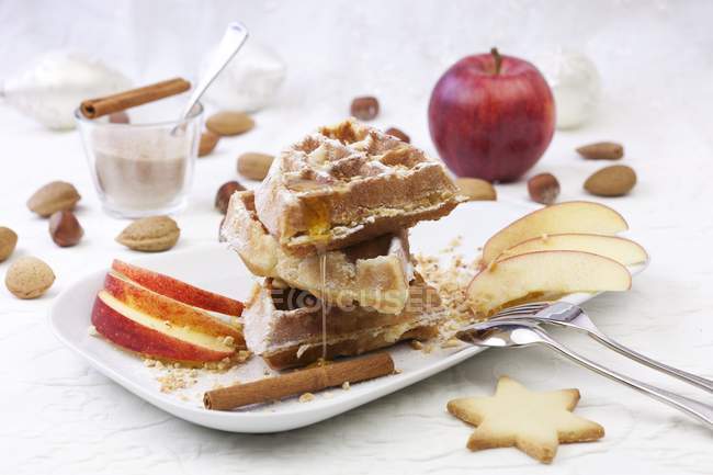 Waffles with apples and cinnamon — Stock Photo