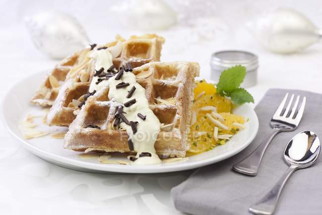 Closeup view of waffle with oranges and pistachios — Stock Photo