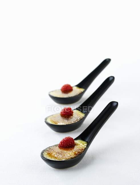 Spoonfuls of creme brulee — Stock Photo