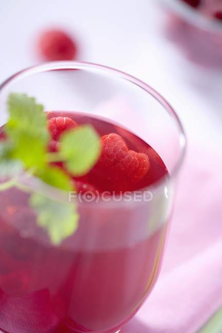 Glass of raspberry juice — Stock Photo
