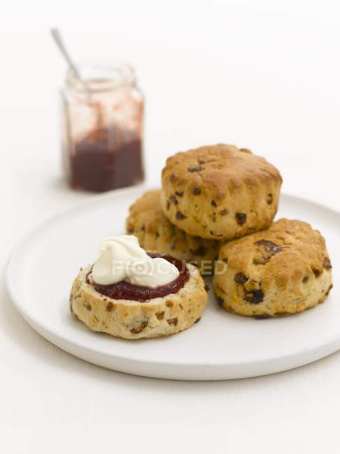 Scones with cream and jam — Stock Photo