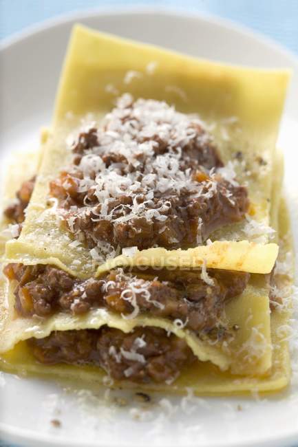 Lasagne with meat sauce and grated cheese — Stock Photo