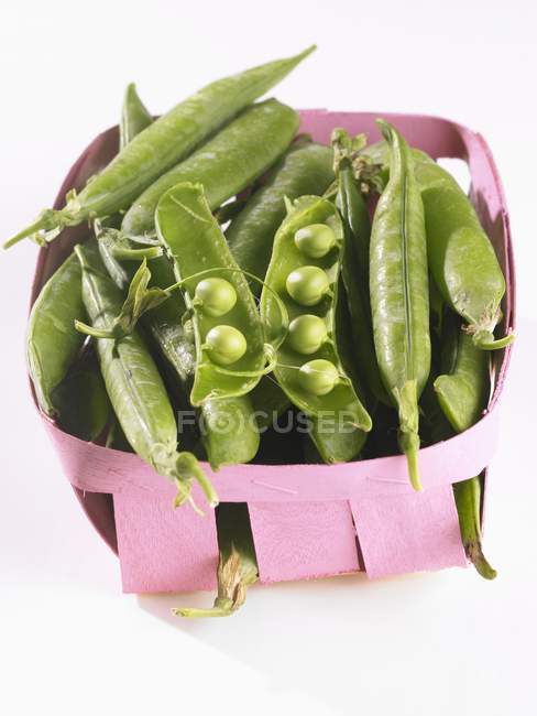 Pea pods in a punnet — Stock Photo
