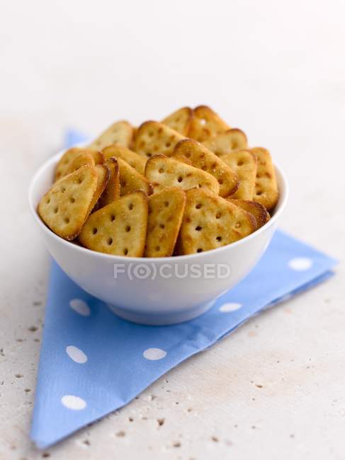 Closeup view of a white bowl of snacks — Stock Photo