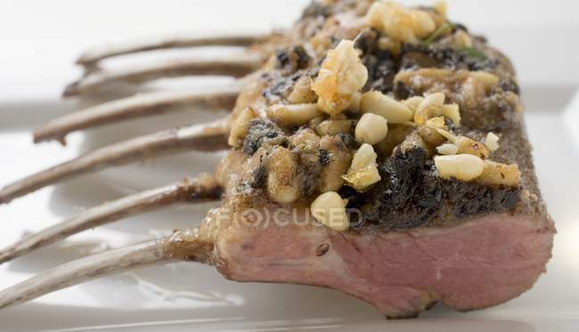 Roasted Rack of lamb with pesto crust — Stock Photo