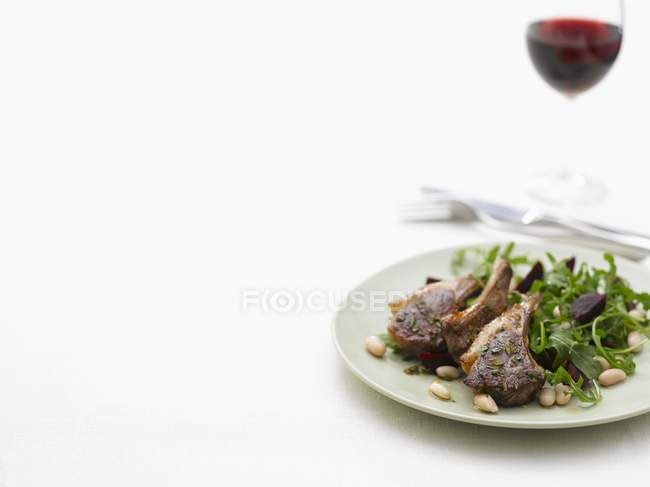 Lamb chops with mixed leaf salad — Stock Photo