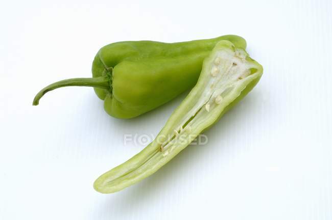 Green pointed pepper with half — Stock Photo