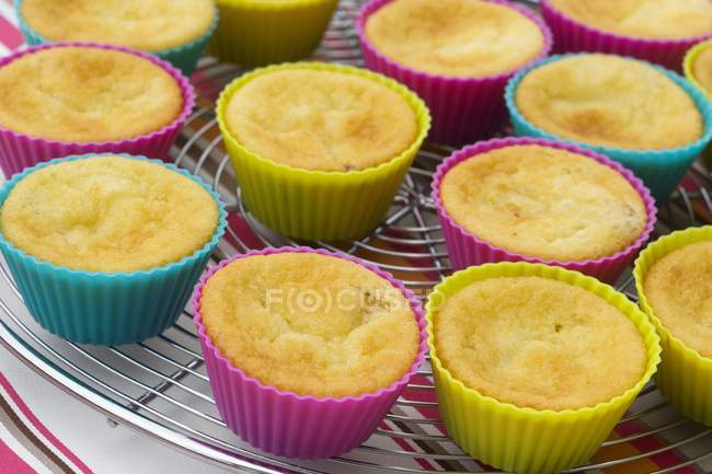 Mini butter cakes in colorful papers — Stock Photo