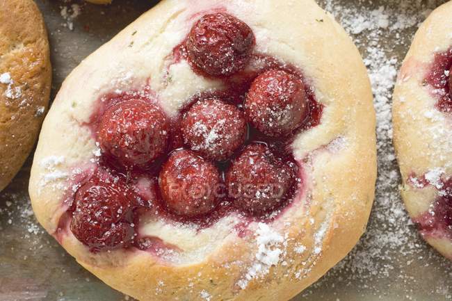 Focaccia with cherries on wooden — Stock Photo