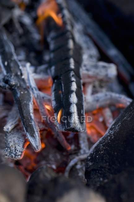Closeup view of glowing charcoals heap — Stock Photo
