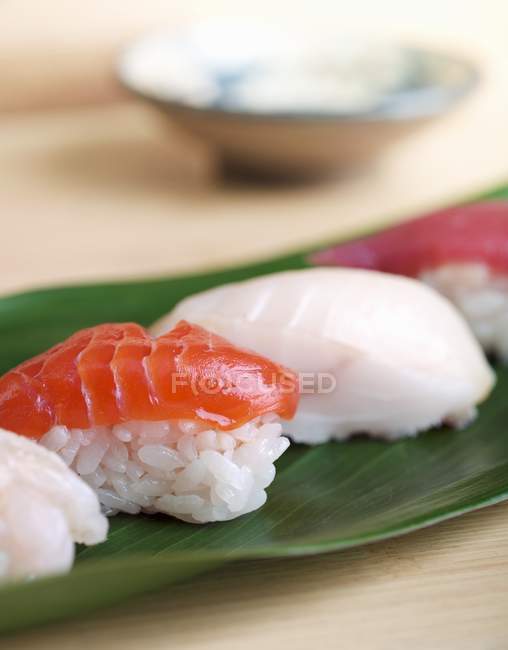 Assorted of sushi on leaf — Stock Photo