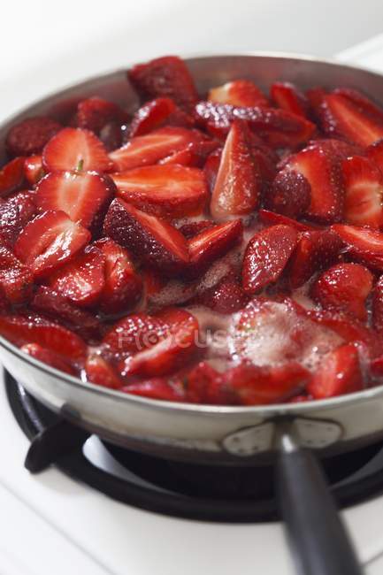 Strawberries boiling for strawberry jam — Stock Photo