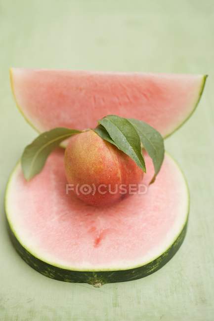Nectarine and sliced watermelon — Stock Photo