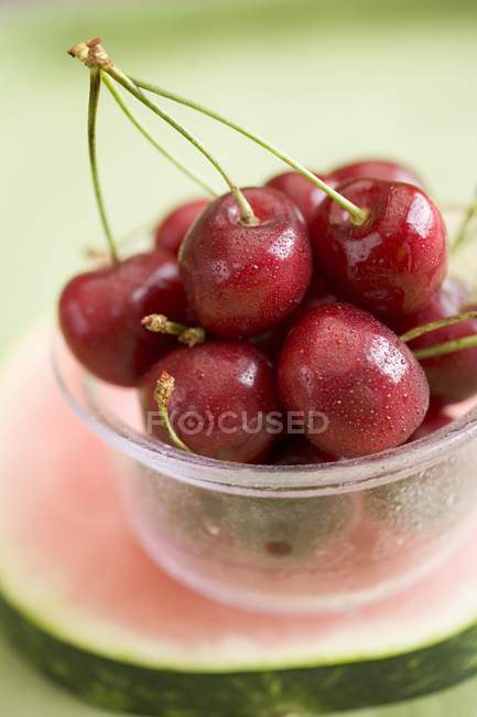 Cherries in plastic tub — Stock Photo