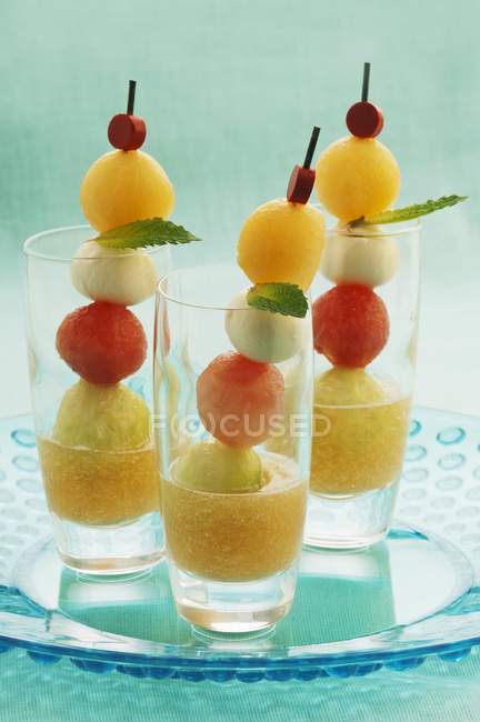 Closeup view of melon shooters in glasses — Stock Photo