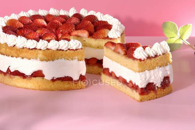 Partly sliced Strawberry cake — Stock Photo