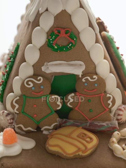 Gingerbread house with people — Stock Photo