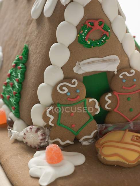 Gingerbread house with people — Stock Photo