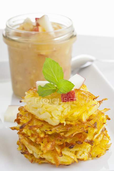 Staked Potato fritters with apple puree — Stock Photo