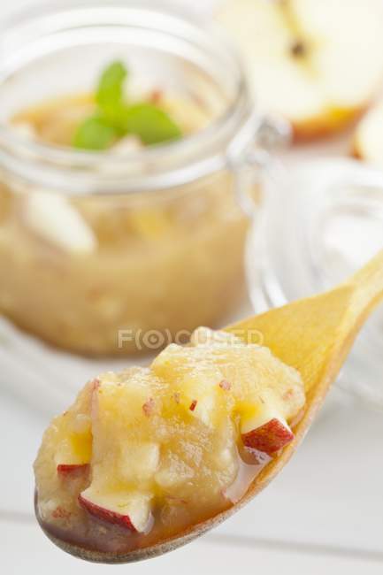 Closeup view of apple sauce with pieces of apple — Stock Photo