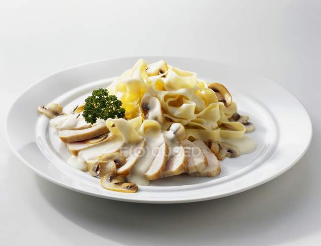 Chicken breast and tagliatelle pasta — Stock Photo