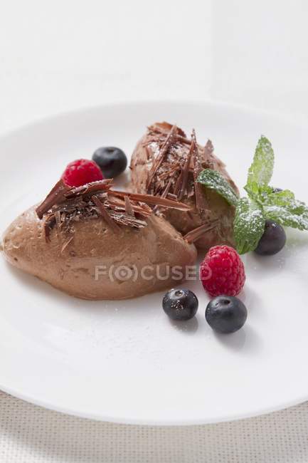 Mousse garnished with fresh berries — Stock Photo