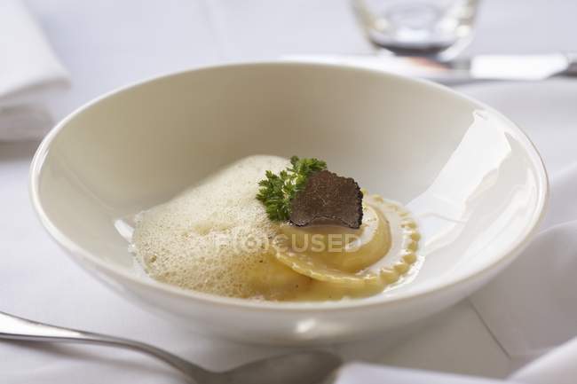 Duck ravioli with truffle mushroom slice — Stock Photo