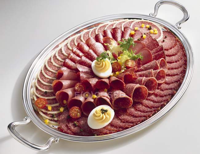 Salami platter with eggs — Stock Photo