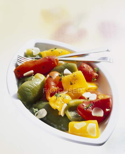 Closeup view of marinated peppers with garlic — Stock Photo