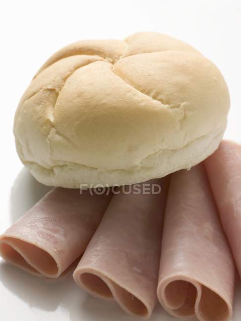 Bread roll on slices — Stock Photo