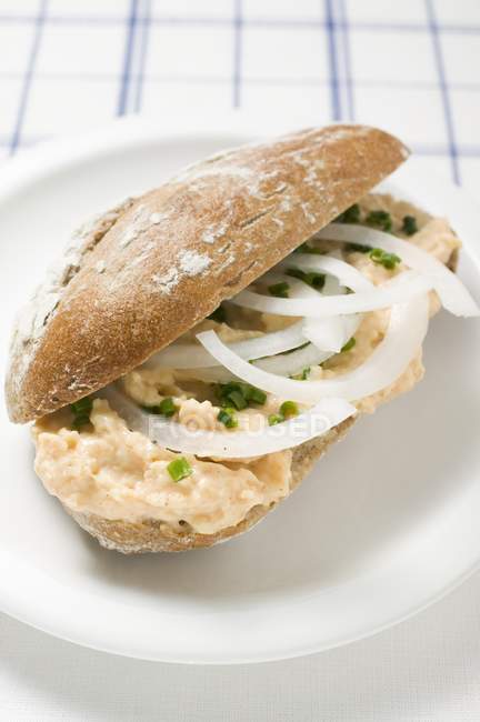 Bread roll filled Obatzda — Stock Photo