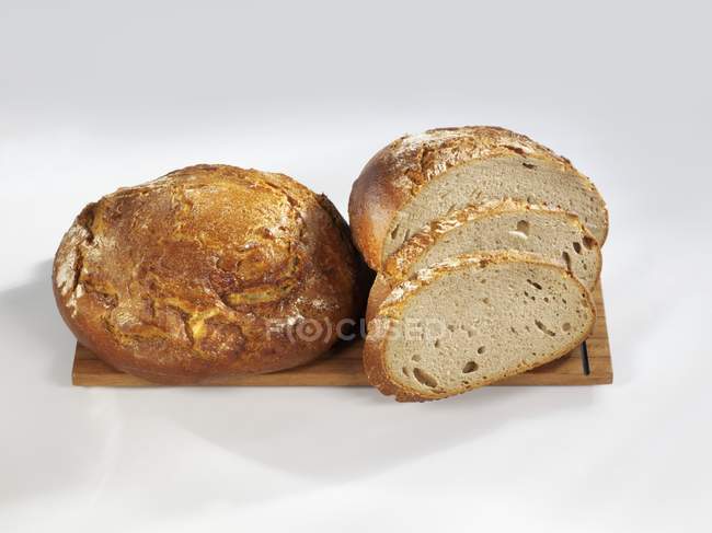 Loaves of bread on board — Stock Photo
