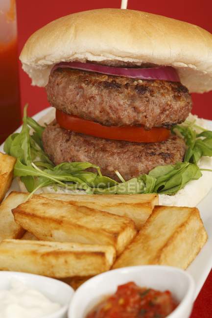 Hamburger with fries and salsa — Stock Photo