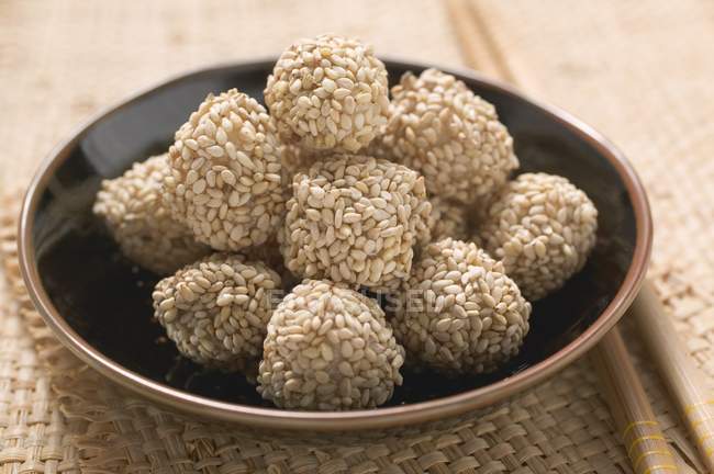 Closeup view of sweet sesame balls on plate — Stock Photo