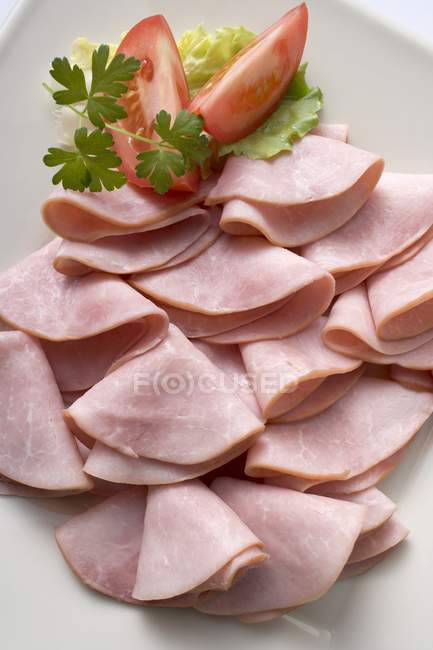 Slices of raw ham — Stock Photo