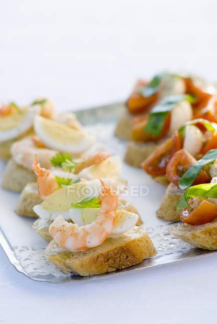 Canaps with prawn on tray — Stock Photo