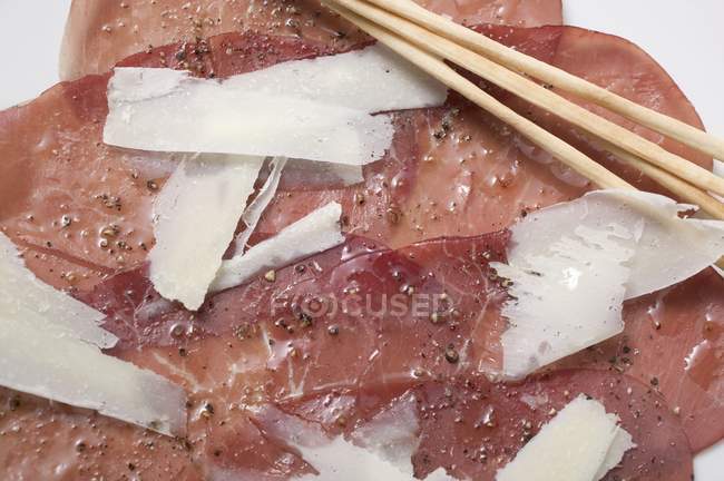 Beef carpaccio with Parmesan — Stock Photo