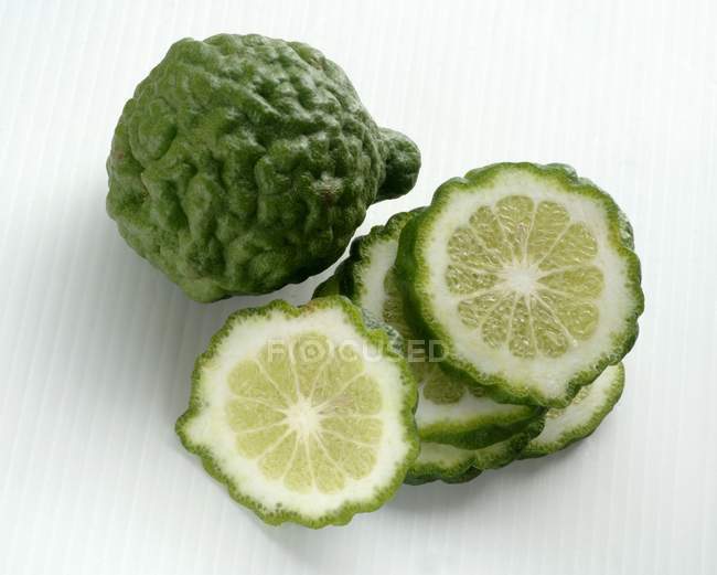 Kaffir limes with slices — Stock Photo