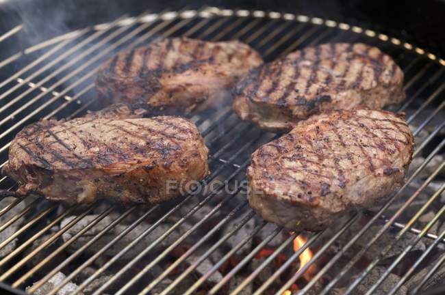 Four beef steaks — Stock Photo
