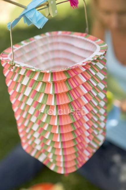 Closeup daytime view of colored Chinese lantern on washing line — Stock Photo